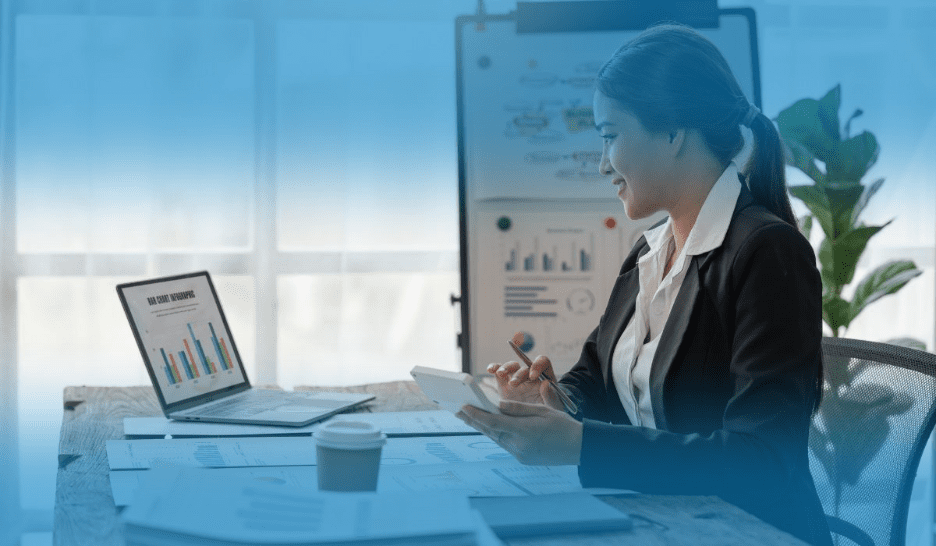 Tax agent working with financial documents and calculator at a desk