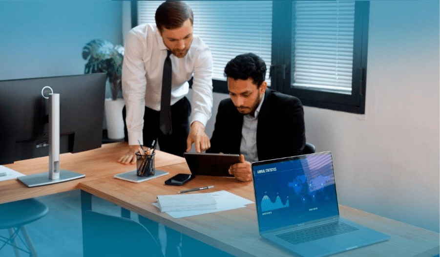 Crypto tax accountant reviewing financial charts and Bitcoin data on a laptop