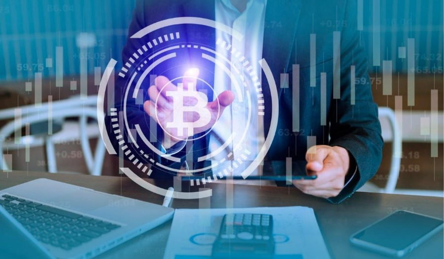 Crypto tax professionals reviewing annual statistics on a tablet and laptop
